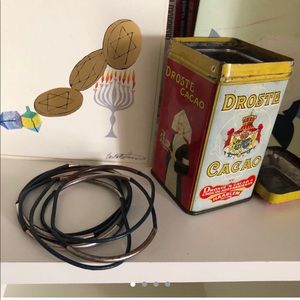 Set of 7 navy leather bracelets w/ metal cuffs.